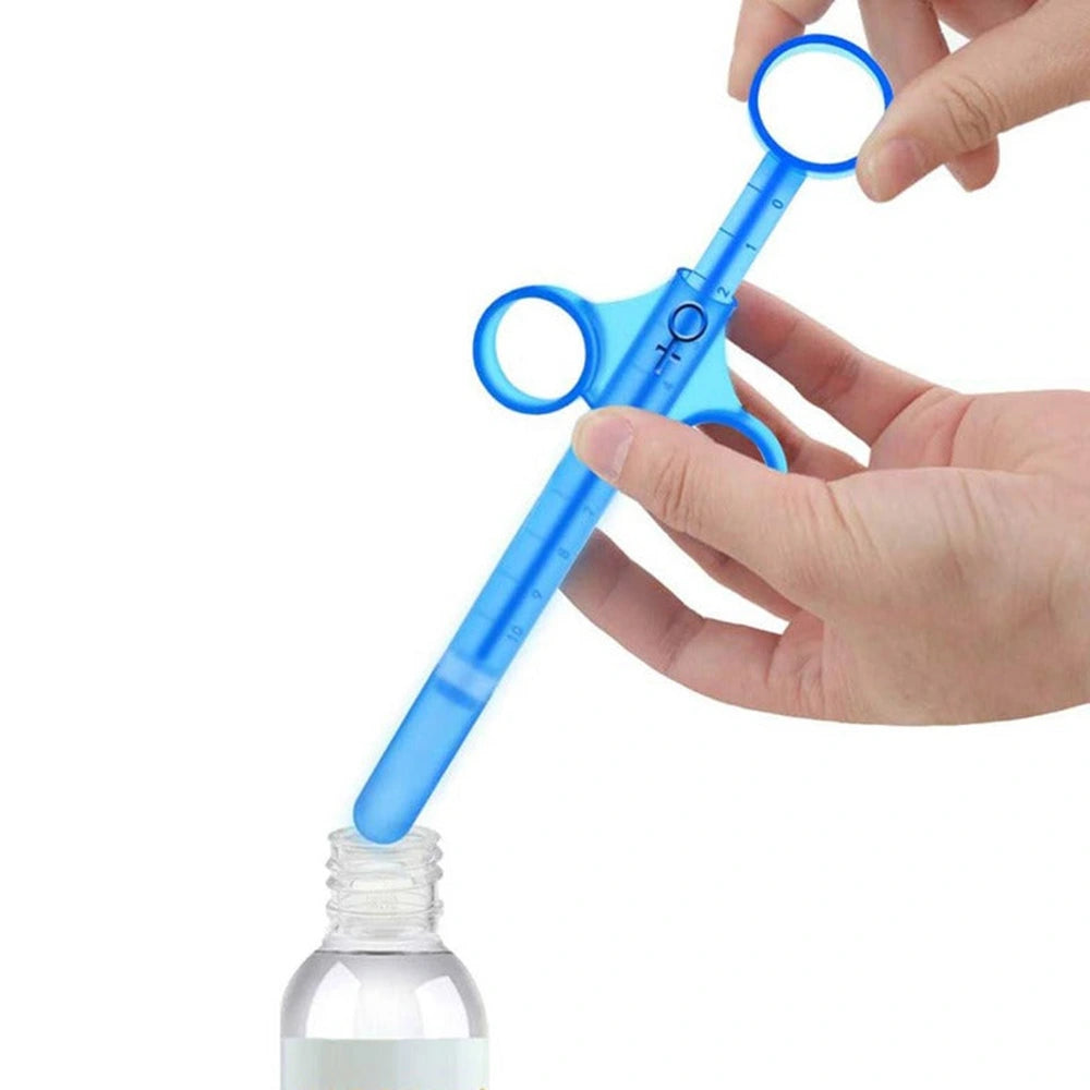 Blue lubricant applicator being filled from bottle – precision nozzle with finger grip design